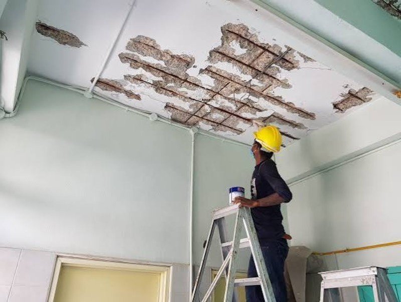 Crew completing structural repairs after fire damage